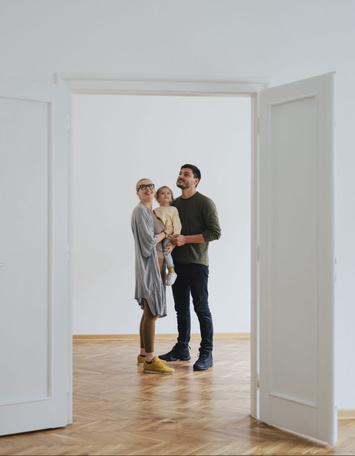 An excited family looking at their new home